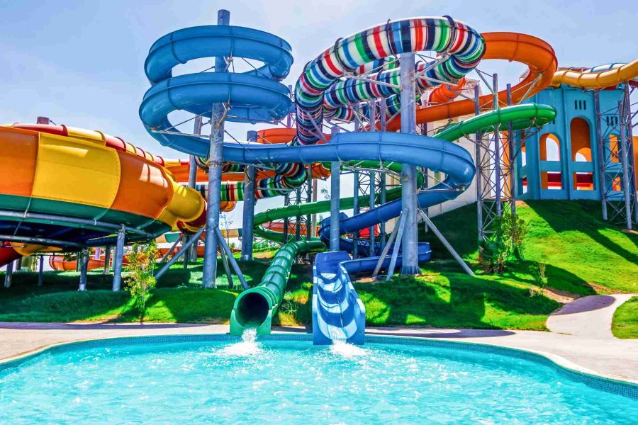 Families enjoying water slides, pools, and summer activities at Makadi Aqua Park in Hurghada, Red Sea resort.