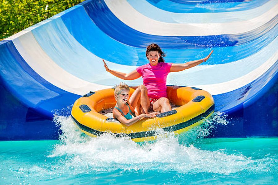 Family enjoying water slides and pools at Nefertiti Aqua Park Hurghada with sea access and full-day fun