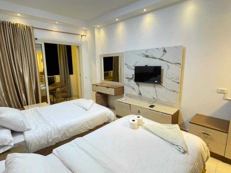 Studio with pool view at Florenza Khamsin Hurghada featuring 2 small beds and first-floor access