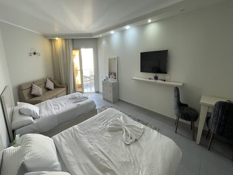 Sea and pool view studio at Scandic Resort Hurghada, 5th floor, 2 small beds and sofa bed, suitable for up to 3 guests.