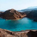 Scenic travel spots around the world featuring mountains, beaches, and cultural landmarks