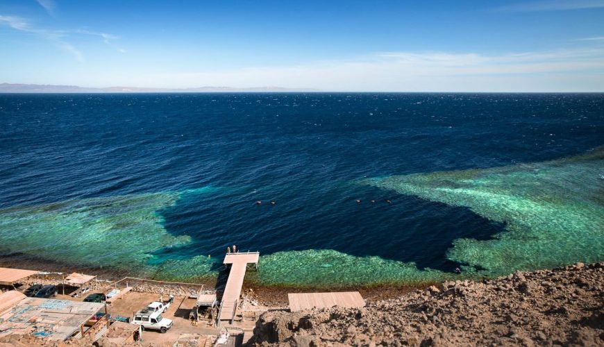 Dahab’s Blue Hole in Egypt with crystal-clear waters and vibrant marine life, popular for diving and snorkeling