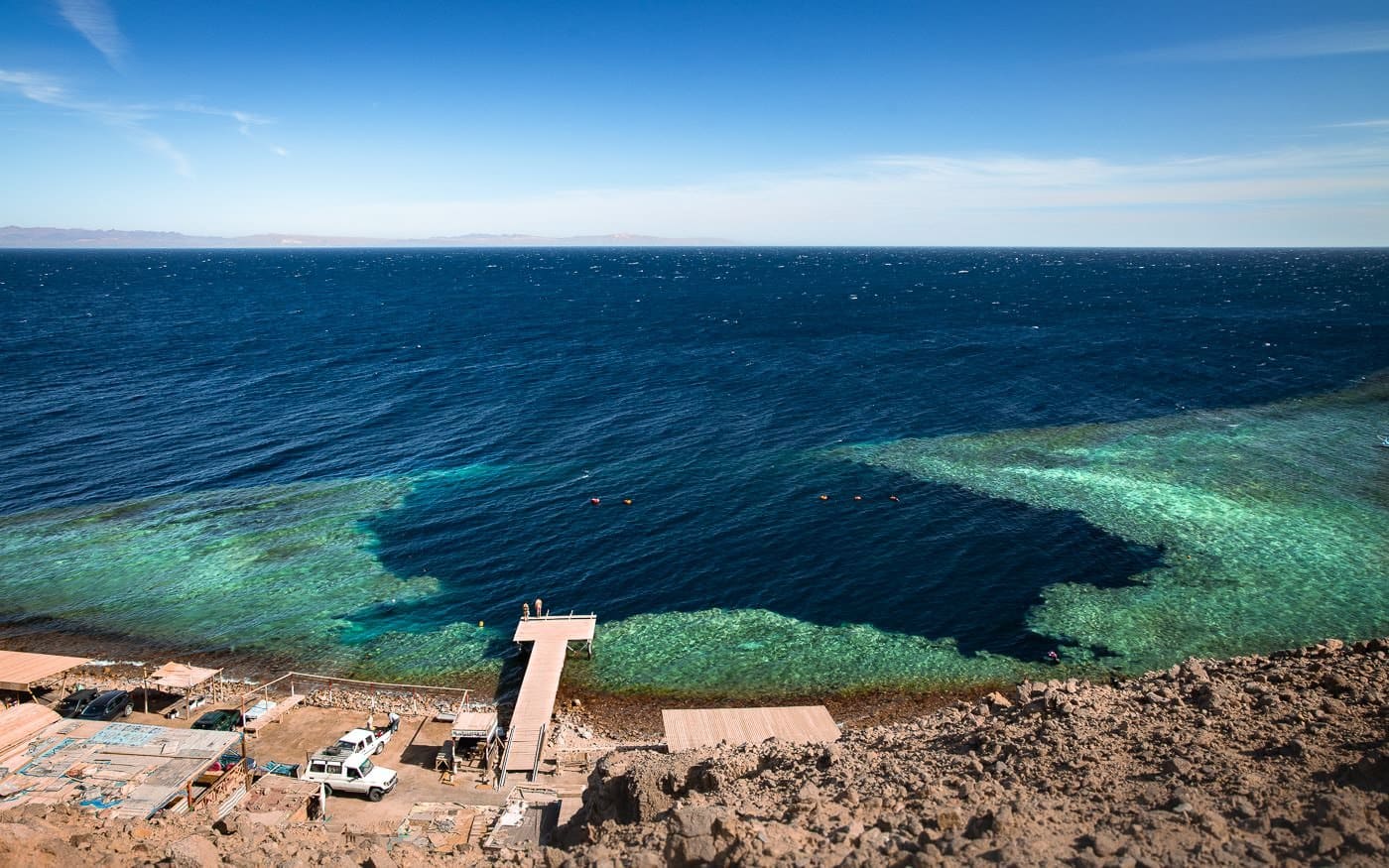 Dahab’s Blue Hole in Egypt with crystal-clear waters and vibrant marine life, popular for diving and snorkeling