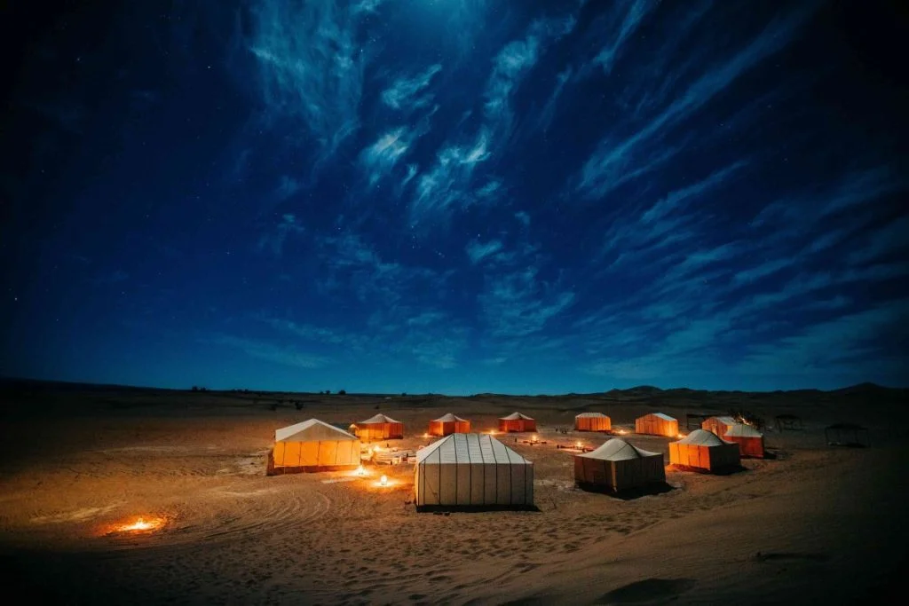 Siwa Oasis Camping under the stars surrounded by desert dunes and palm trees