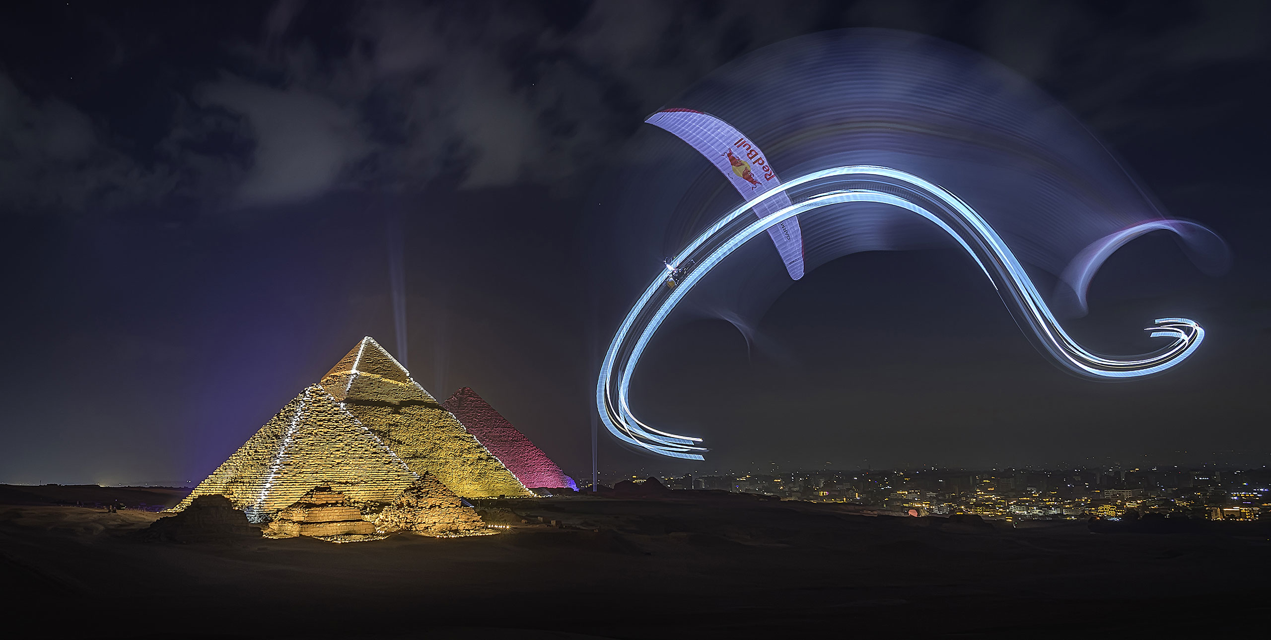 Night paramotoring over the Pyramids of Giza under the stars