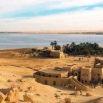 Scenic desert landscape of Siwa Oasis with palm trees and salt lakes in Egypt