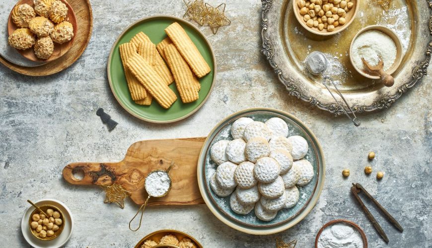 Traditional festive foods for Eid in Egypt including Kahk, Baklava, and Koshari