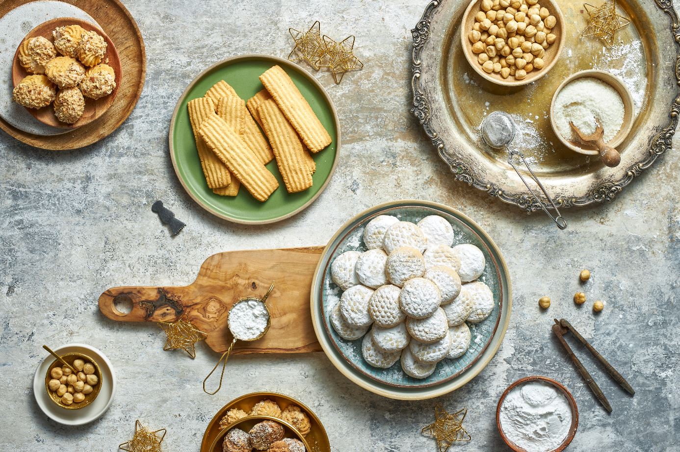 Traditional festive foods for Eid in Egypt including Kahk, Baklava, and Koshari