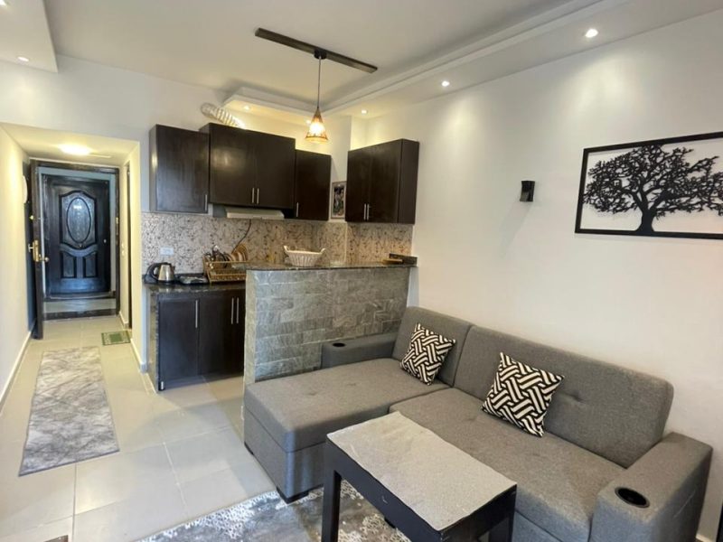 One-bedroom apartment with sea view at Florenza Khamsin Hurghada, 2nd floor, 2 small beds and sofa bed, suitable for up to 3 guests.
