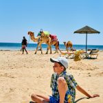 Family enjoying a holiday in Hurghada with kids on a Red Sea beach