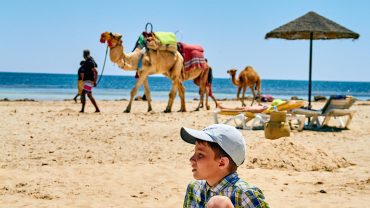 Family enjoying a holiday in Hurghada with kids on a Red Sea beach