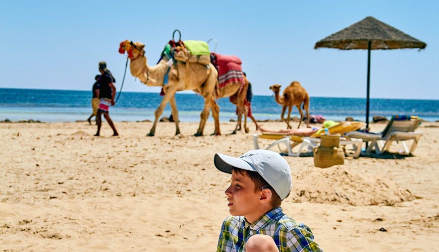 Family enjoying a holiday in Hurghada with kids on a Red Sea beach