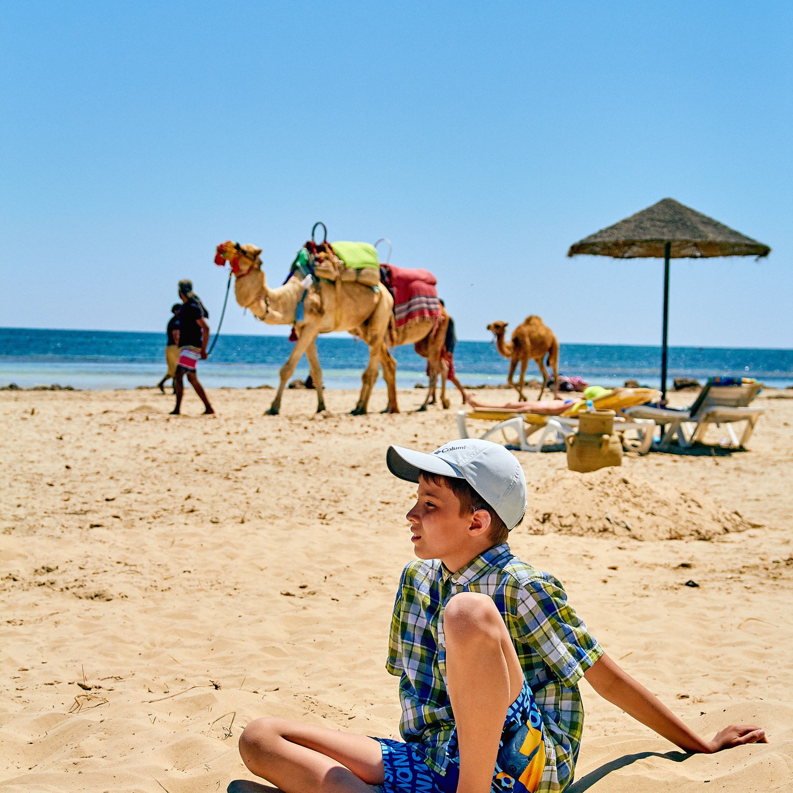 Family enjoying a holiday in Hurghada with kids on a Red Sea beach