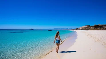 Visitors enjoying Mahmya Island near Hurghada, with sandy beaches, clear Red Sea water, and a snorkeling excursion.