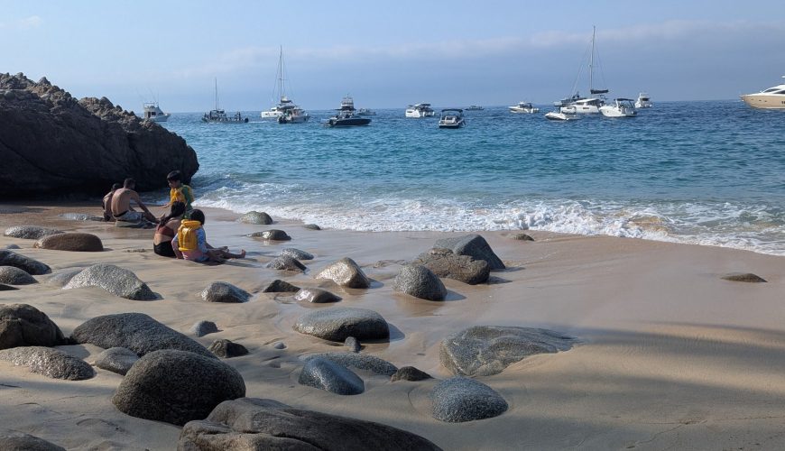 A peaceful sandy beach near Hurghada with clear turquoise water and scenic views of the Red Sea