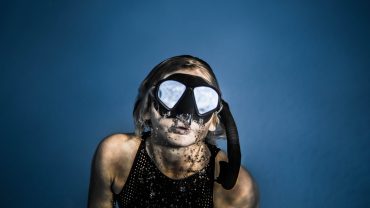 Beginner scuba diver exploring a coral reef in Hurghada