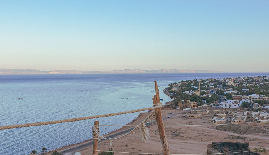 Turquoise Red Sea waters and sandy beaches in Hurghada, Egypt, with boats ready for marine excursions