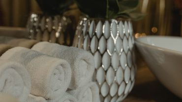 Traditional Turkish hammam interior prepared for a relaxing bath ritual with warm marble surfaces and spa facilities.