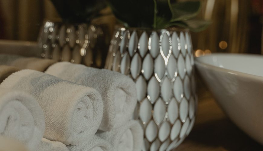 Traditional Turkish hammam interior prepared for a relaxing bath ritual with warm marble surfaces and spa facilities.