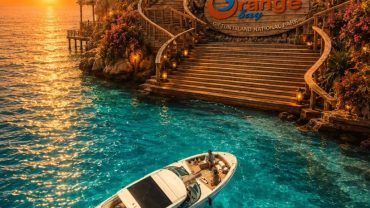 Visitors enjoying the turquoise waters and sandy beach of Orange Bay Island during a boat excursion from Hurghada.
