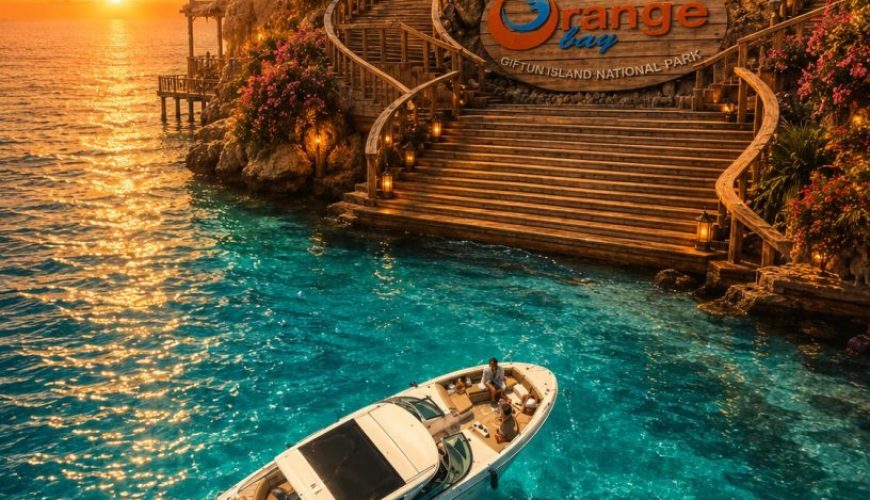Visitors enjoying the turquoise waters and sandy beach of Orange Bay Island during a boat excursion from Hurghada.